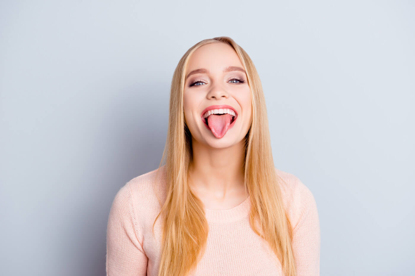 Women playfully sticking out her tongue